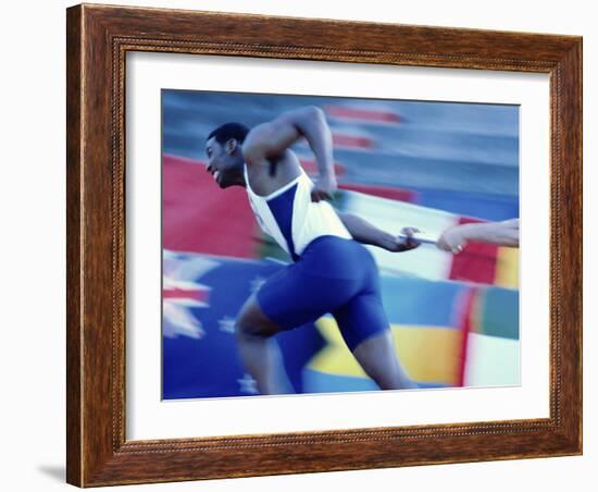 Side Profile of Runners Passing a Baton in a Relay Race-null-Framed Photographic Print