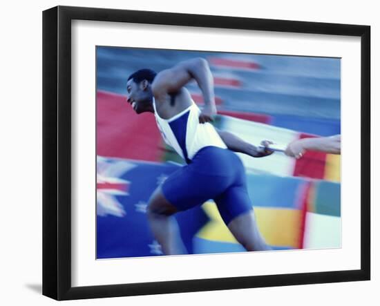 Side Profile of Runners Passing a Baton in a Relay Race-null-Framed Photographic Print