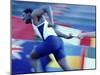 Side Profile of Runners Passing a Baton in a Relay Race-null-Mounted Photographic Print