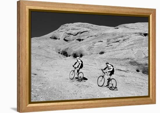 Side profile of two men mountain bilking on rocks, Slickrock Trail, Moab, Utah, USA-Richard Sisk-Framed Premier Image Canvas