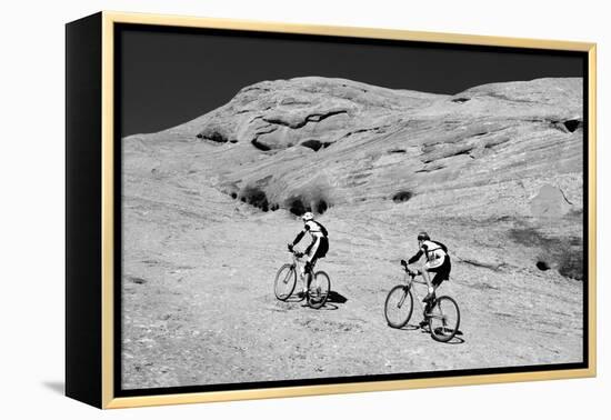 Side profile of two men mountain bilking on rocks, Slickrock Trail, Moab, Utah, USA-Richard Sisk-Framed Premier Image Canvas