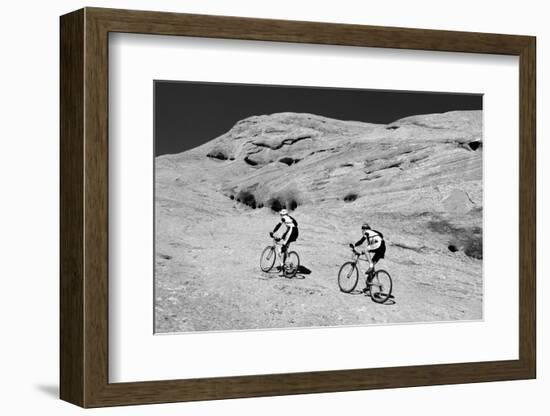 Side profile of two men mountain bilking on rocks, Slickrock Trail, Moab, Utah, USA-Richard Sisk-Framed Photographic Print