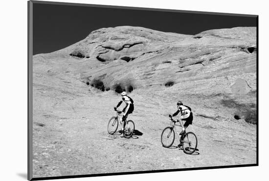 Side profile of two men mountain bilking on rocks, Slickrock Trail, Moab, Utah, USA-Richard Sisk-Mounted Photographic Print