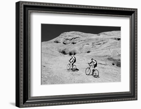 Side profile of two men mountain bilking on rocks, Slickrock Trail, Moab, Utah, USA-Richard Sisk-Framed Photographic Print