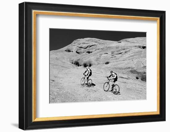 Side profile of two men mountain bilking on rocks, Slickrock Trail, Moab, Utah, USA-Richard Sisk-Framed Photographic Print