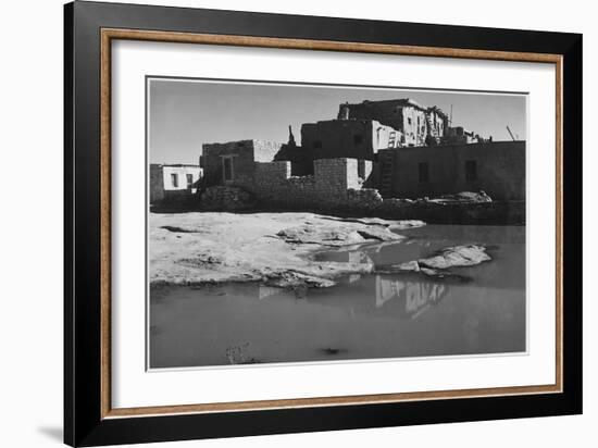 Side View Of Adobe House With Water In Foreground" Acoma Pueblo [NHL New Mexico]." 1933-1942-Ansel Adams-Framed Art Print