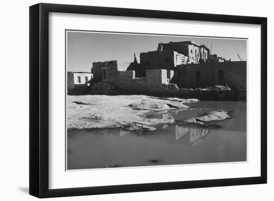 Side View Of Adobe House With Water In Foreground" Acoma Pueblo [NHL New Mexico]." 1933-1942-Ansel Adams-Framed Art Print