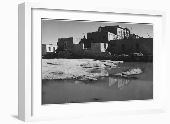 Side View Of Adobe House With Water In Foreground" Acoma Pueblo [NHL New Mexico]." 1933-1942-Ansel Adams-Framed Art Print