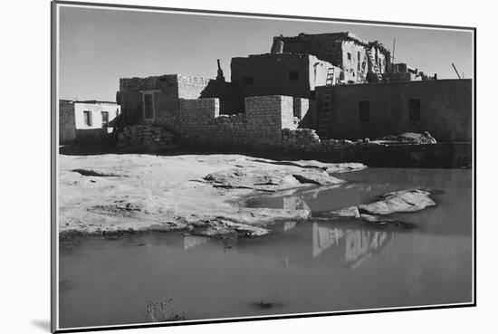 Side View Of Adobe House With Water In Foreground" Acoma Pueblo [NHL New Mexico]." 1933-1942-Ansel Adams-Mounted Art Print