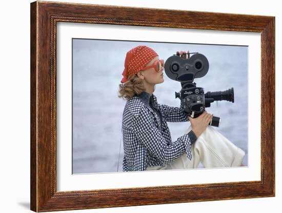 Side View of Model Holding a Movie Camera, Filming in Paradise Island, Bahamas-Gianni Penati-Framed Premium Giclee Print