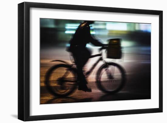 Side View With Motion Blur Of A Delivery Man Riding A Bicycle At Night In Downtown Manhattan-Ron Koeberer-Framed Photographic Print