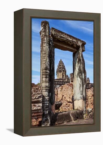 Siem Reap, Cambodia. Ancient doorway still standing through which the spires and statues atop of th-Miva Stock-Framed Premier Image Canvas