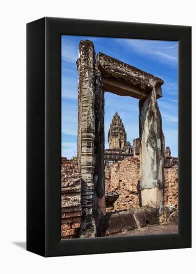 Siem Reap, Cambodia. Ancient doorway still standing through which the spires and statues atop of th-Miva Stock-Framed Premier Image Canvas