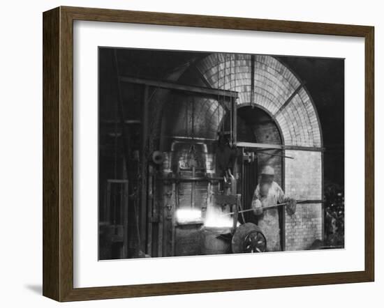 Siemens and Schukert Brass Foundry, Where Worker Has His Face Covered to Protect Against Fumes-Emil Otto Hoppé-Framed Photographic Print