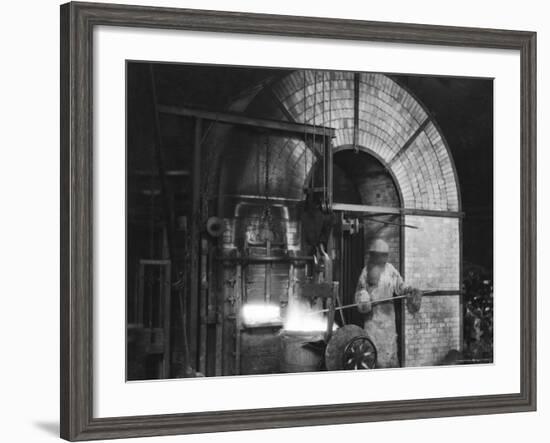 Siemens and Schukert Brass Foundry, Where Worker Has His Face Covered to Protect Against Fumes-Emil Otto Hoppé-Framed Photographic Print