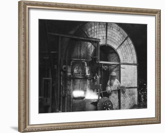 Siemens and Schukert Brass Foundry, Where Worker Has His Face Covered to Protect Against Fumes-Emil Otto Hoppé-Framed Photographic Print