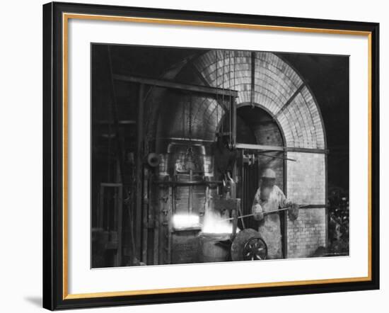 Siemens and Schukert Brass Foundry, Where Worker Has His Face Covered to Protect Against Fumes-Emil Otto Hoppé-Framed Photographic Print