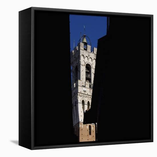 Siena Architectural Details. Glimpse of Crenellated Tower with Bell-Mike Burton-Framed Premier Image Canvas