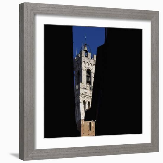 Siena Architectural Details. Glimpse of Crenellated Tower with Bell-Mike Burton-Framed Photographic Print