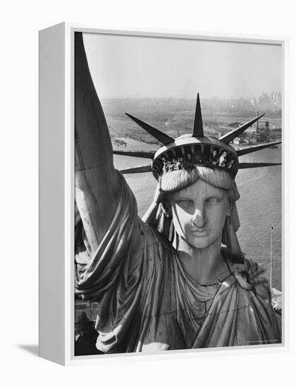 Sightseers Hanging Out Windows in Crown of Statue of Liberty with NJ Shore in the Background-Margaret Bourke-White-Framed Premier Image Canvas