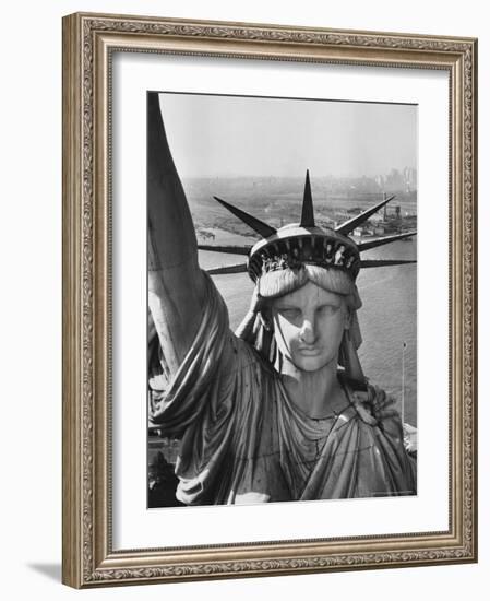 Sightseers Hanging Out Windows in Crown of Statue of Liberty with NJ Shore in the Background-Margaret Bourke-White-Framed Photographic Print