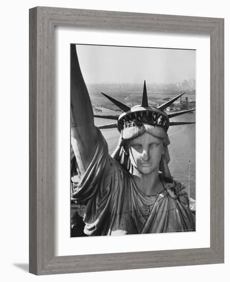Sightseers Hanging Out Windows in Crown of Statue of Liberty with NJ Shore in the Background-Margaret Bourke-White-Framed Photographic Print