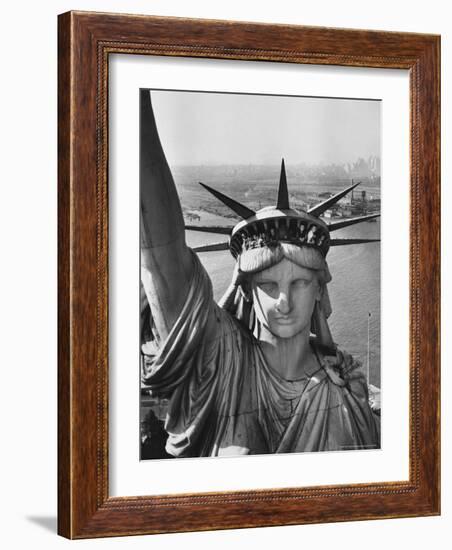 Sightseers Hanging Out Windows in Crown of Statue of Liberty with NJ Shore in the Background-Margaret Bourke-White-Framed Photographic Print