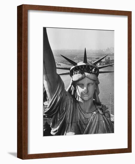 Sightseers Hanging Out Windows in Crown of Statue of Liberty with NJ Shore in the Background-Margaret Bourke-White-Framed Photographic Print