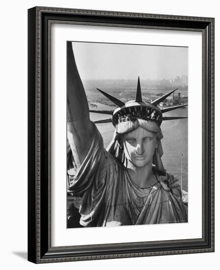 Sightseers Hanging Out Windows in Crown of Statue of Liberty with NJ Shore in the Background-Margaret Bourke-White-Framed Photographic Print