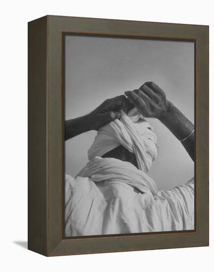 Sikh Man Demonstrating How He Finishes the Winding of His Traditional Turban around His Head-Margaret Bourke-White-Framed Premier Image Canvas