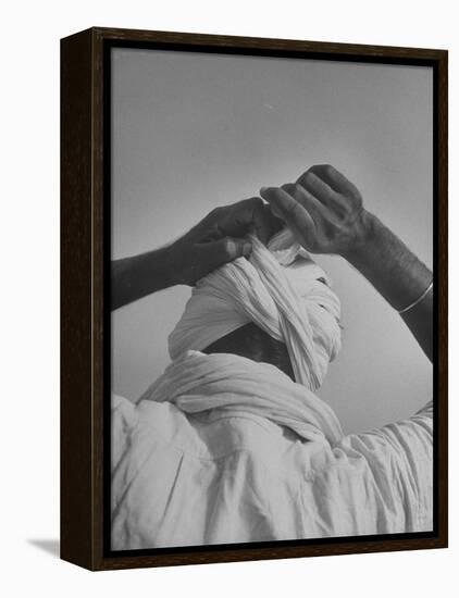 Sikh Man Demonstrating How He Finishes the Winding of His Traditional Turban around His Head-Margaret Bourke-White-Framed Premier Image Canvas