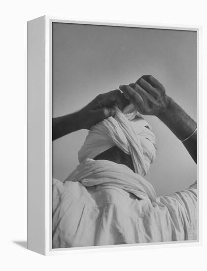 Sikh Man Demonstrating How He Finishes the Winding of His Traditional Turban around His Head-Margaret Bourke-White-Framed Premier Image Canvas