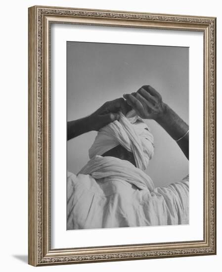 Sikh Man Demonstrating How He Finishes the Winding of His Traditional Turban around His Head-Margaret Bourke-White-Framed Photographic Print