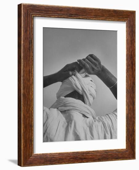 Sikh Man Demonstrating How He Finishes the Winding of His Traditional Turban around His Head-Margaret Bourke-White-Framed Photographic Print