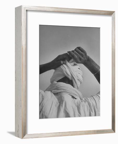 Sikh Man Demonstrating How He Finishes the Winding of His Traditional Turban around His Head-Margaret Bourke-White-Framed Photographic Print