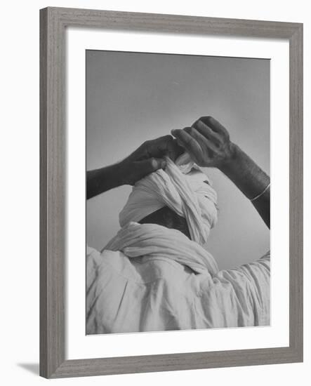 Sikh Man Demonstrating How He Finishes the Winding of His Traditional Turban around His Head-Margaret Bourke-White-Framed Photographic Print