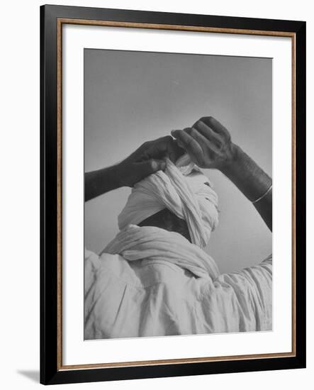 Sikh Man Demonstrating How He Finishes the Winding of His Traditional Turban around His Head-Margaret Bourke-White-Framed Photographic Print