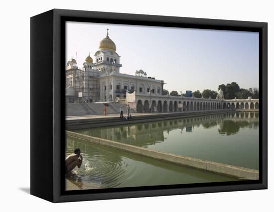 Sikh Pilgrim Bathing in the Pool of the Gurudwara Bangla Sahib Temple, Delhi, India-Eitan Simanor-Framed Premier Image Canvas