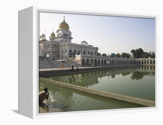 Sikh Pilgrim Bathing in the Pool of the Gurudwara Bangla Sahib Temple, Delhi, India-Eitan Simanor-Framed Premier Image Canvas