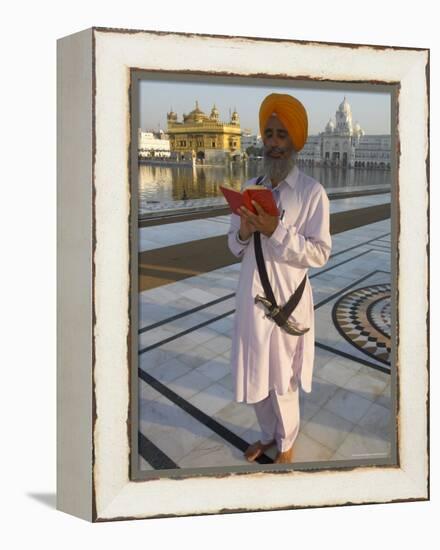 Sikh Pilgrim with Orange Turban, White Dress and Dagger, Reading Prayer Book, Amritsar-Eitan Simanor-Framed Premier Image Canvas