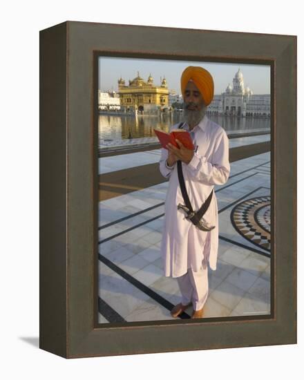 Sikh Pilgrim with Orange Turban, White Dress and Dagger, Reading Prayer Book, Amritsar-Eitan Simanor-Framed Premier Image Canvas