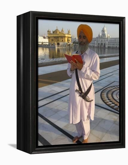 Sikh Pilgrim with Orange Turban, White Dress and Dagger, Reading Prayer Book, Amritsar-Eitan Simanor-Framed Premier Image Canvas