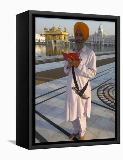 Sikh Pilgrim with Orange Turban, White Dress and Dagger, Reading Prayer Book, Amritsar-Eitan Simanor-Framed Premier Image Canvas