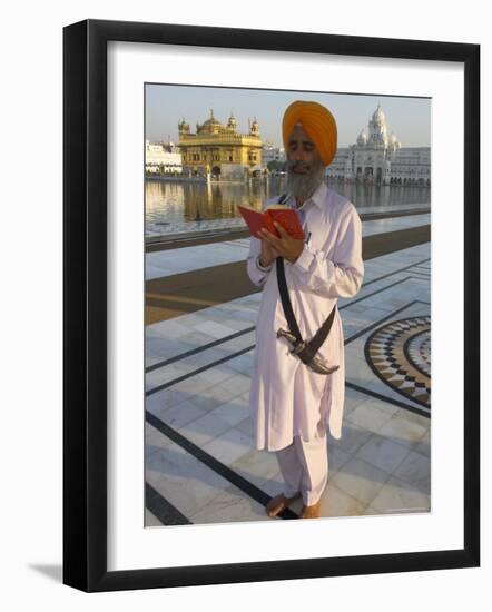 Sikh Pilgrim with Orange Turban, White Dress and Dagger, Reading Prayer Book, Amritsar-Eitan Simanor-Framed Photographic Print