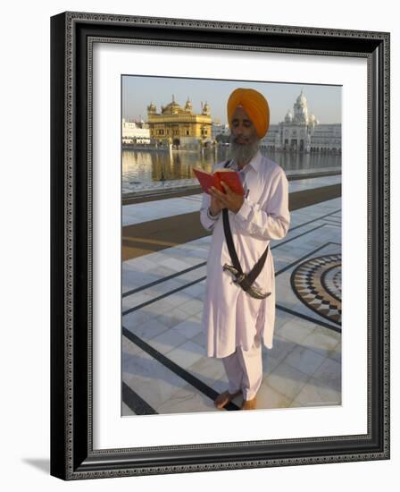 Sikh Pilgrim with Orange Turban, White Dress and Dagger, Reading Prayer Book, Amritsar-Eitan Simanor-Framed Photographic Print