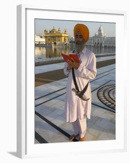 Sikh Pilgrim with Orange Turban, White Dress and Dagger, Reading Prayer Book, Amritsar-Eitan Simanor-Framed Photographic Print