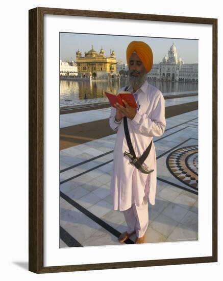 Sikh Pilgrim with Orange Turban, White Dress and Dagger, Reading Prayer Book, Amritsar-Eitan Simanor-Framed Photographic Print