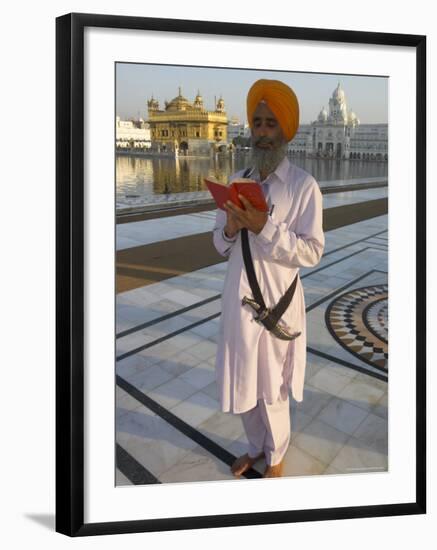 Sikh Pilgrim with Orange Turban, White Dress and Dagger, Reading Prayer Book, Amritsar-Eitan Simanor-Framed Photographic Print
