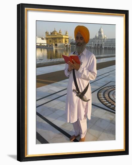 Sikh Pilgrim with Orange Turban, White Dress and Dagger, Reading Prayer Book, Amritsar-Eitan Simanor-Framed Photographic Print