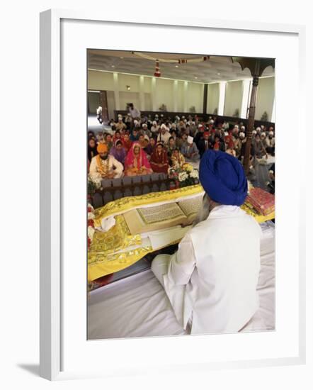 Sikh Priest and Holy Book at Sikh Wedding, London, England, United Kingdom-Charles Bowman-Framed Photographic Print